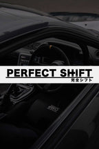 A branded Perfect Shift windshield banner with a darkened car interior at the back