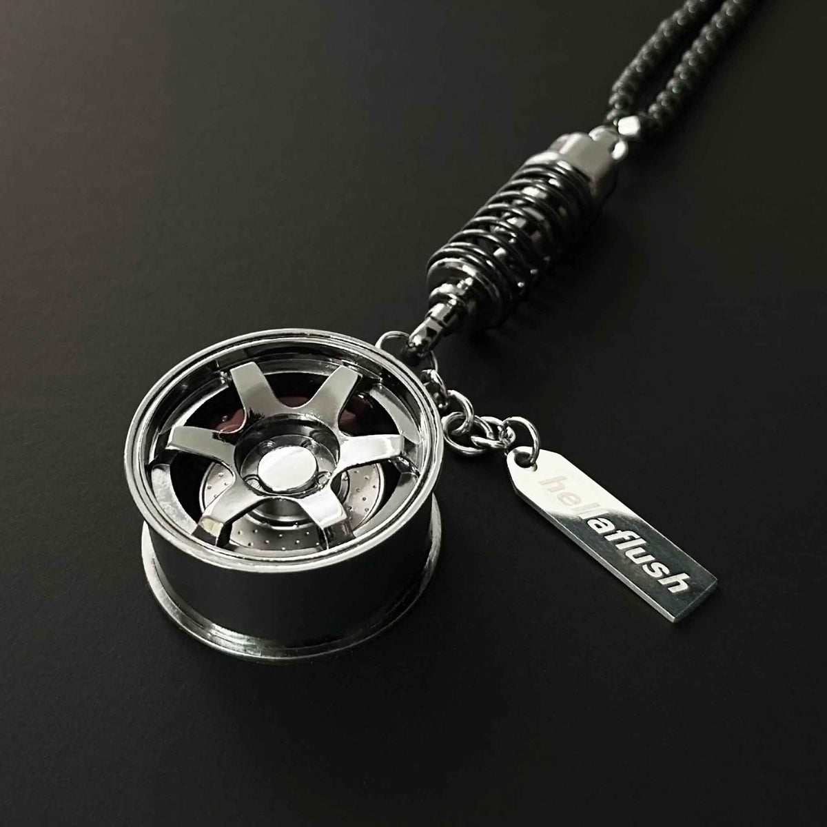 A black TE-37 style wheel decor flat laid on a black background