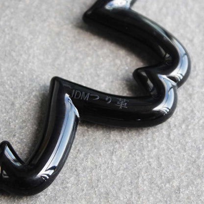 Close-up of a black sakura Tsurikawa where it says 'tsurikawa' in Japanese