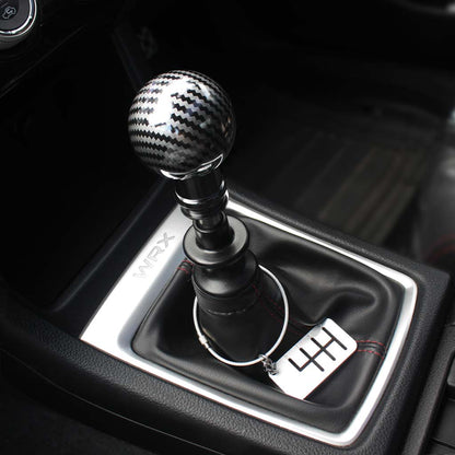 The Obsidian installed on a WRX with a six-speed dog tag hung on the shift boot