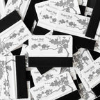 Several JDM banner sticker application squeegees with cherry blossom pattern and Perfect Shift logo on a white background