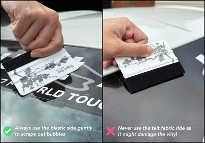 A hand holding a banner sticker application squeegees with cherry blossom pattern and Perfect Shift logo and  provide guidance