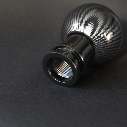 Showcasing the bottom thread of The Obsidian on a black background