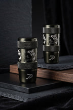 Two black cylindrical stainless steel JDM car shift knobs with textured knurled bands and engraved silver koi fish designs, displayed on a dark tabletop.